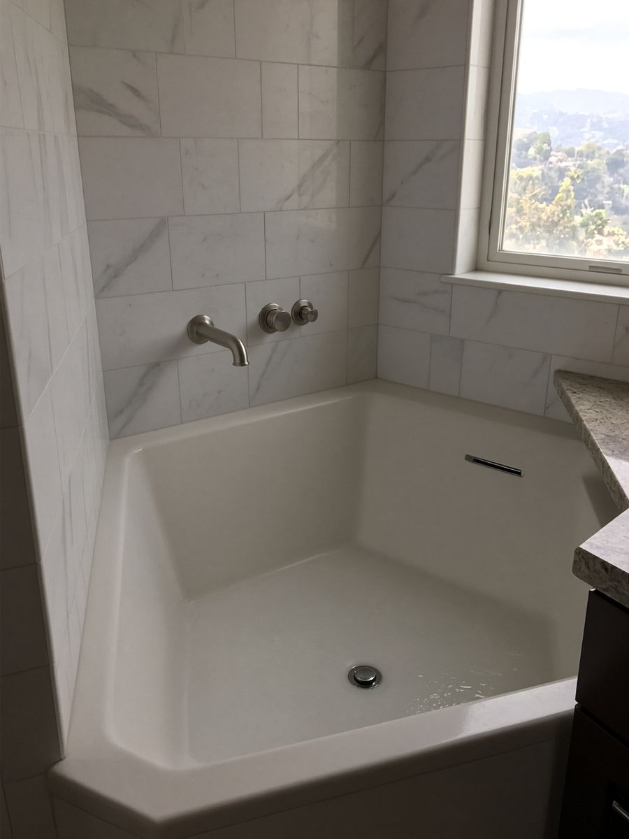 Water sitting at a bathtub drain